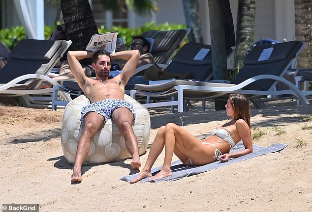 Millie Mackintosh showcases her jaw-dropping figure in a sexy cream bikini while husband Hugo Taylor flaunts his buff body in Mauritius