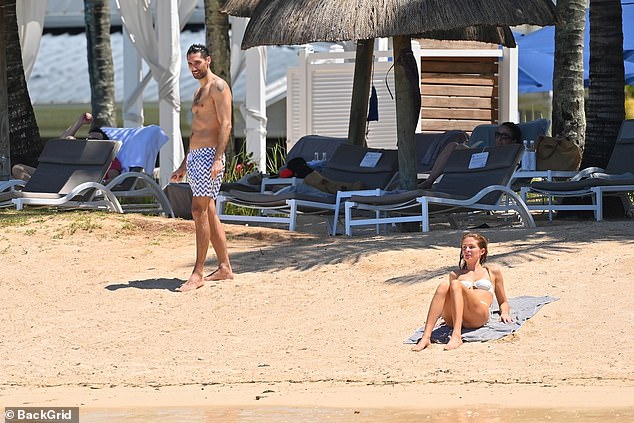 Millie Mackintosh showcases her jaw-dropping figure in a sexy cream bikini while husband Hugo Taylor flaunts his buff body in Mauritius