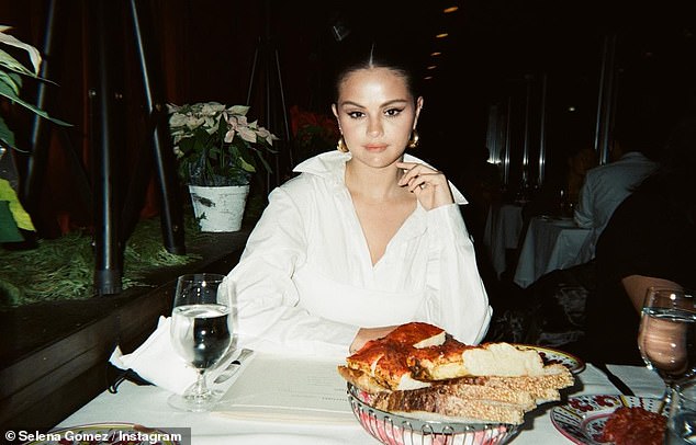 Selena Gomez shares a number of fun throwback snaps including a selfie with younger sister Gracie, 10, ahead of New Year's Eve: 'Moments in time'