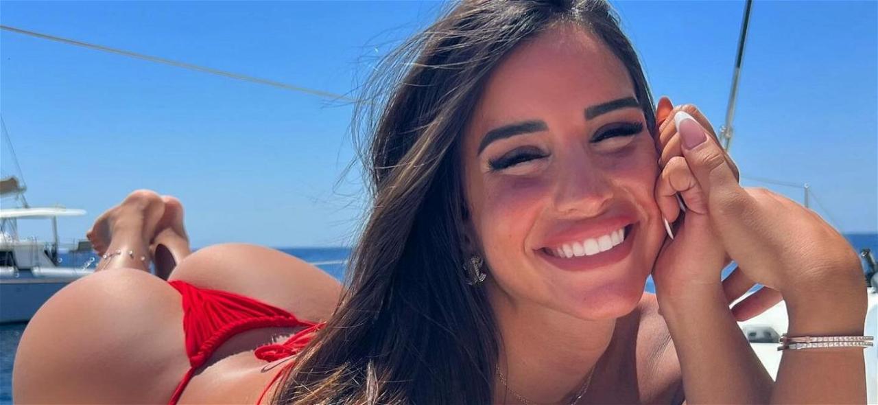 Fitness Queen Avital Cohen Enjoys A Snack In Her Strapless Bikini