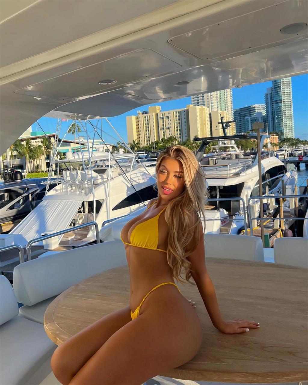 Eve Gale enjoys a boat day in her yellow bikini