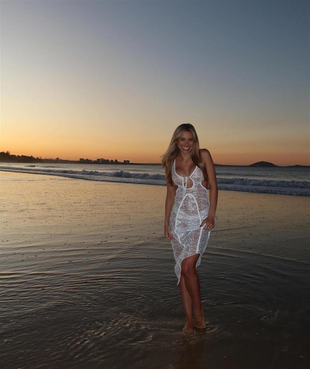 Georgia Hassarati Hits The Beach At Sunset In A See-Through Dress