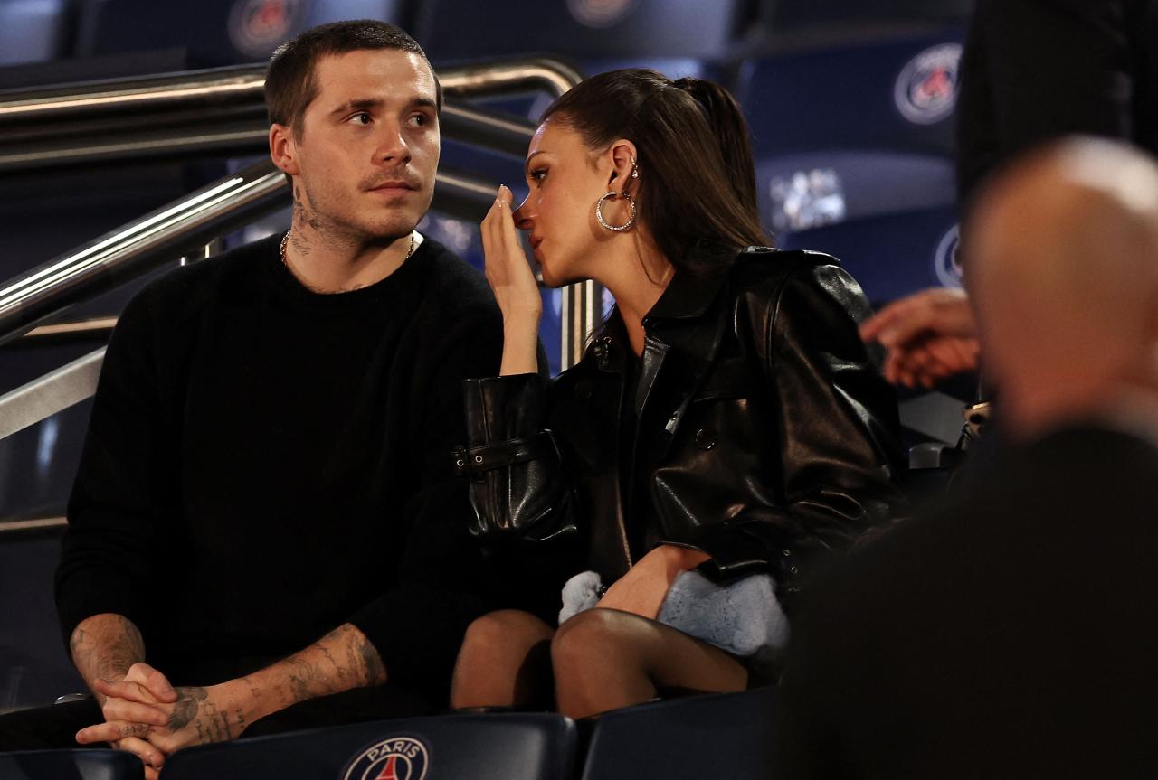 Beckham (L) and his wife Nicola Peltz Beckham attend the French L1 football match between Paris Saint-Germain (PSG) and Olympique de Marseille (OM) at The Parc des Princes Stadium in Paris on September 24, 2023.