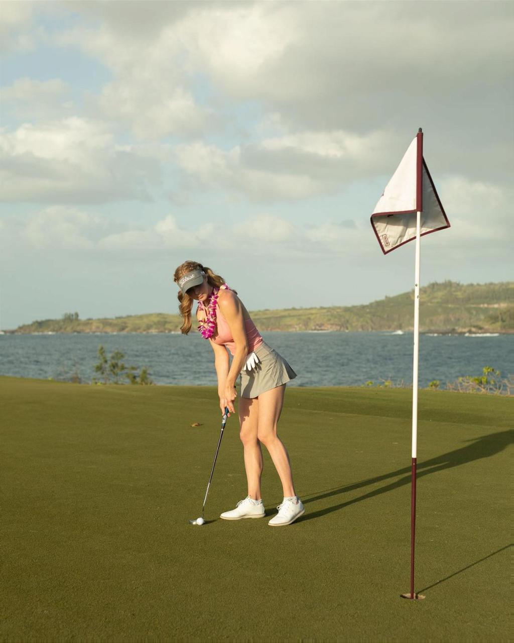 Grace Charis golfs in her busty crop top in Hawaii 