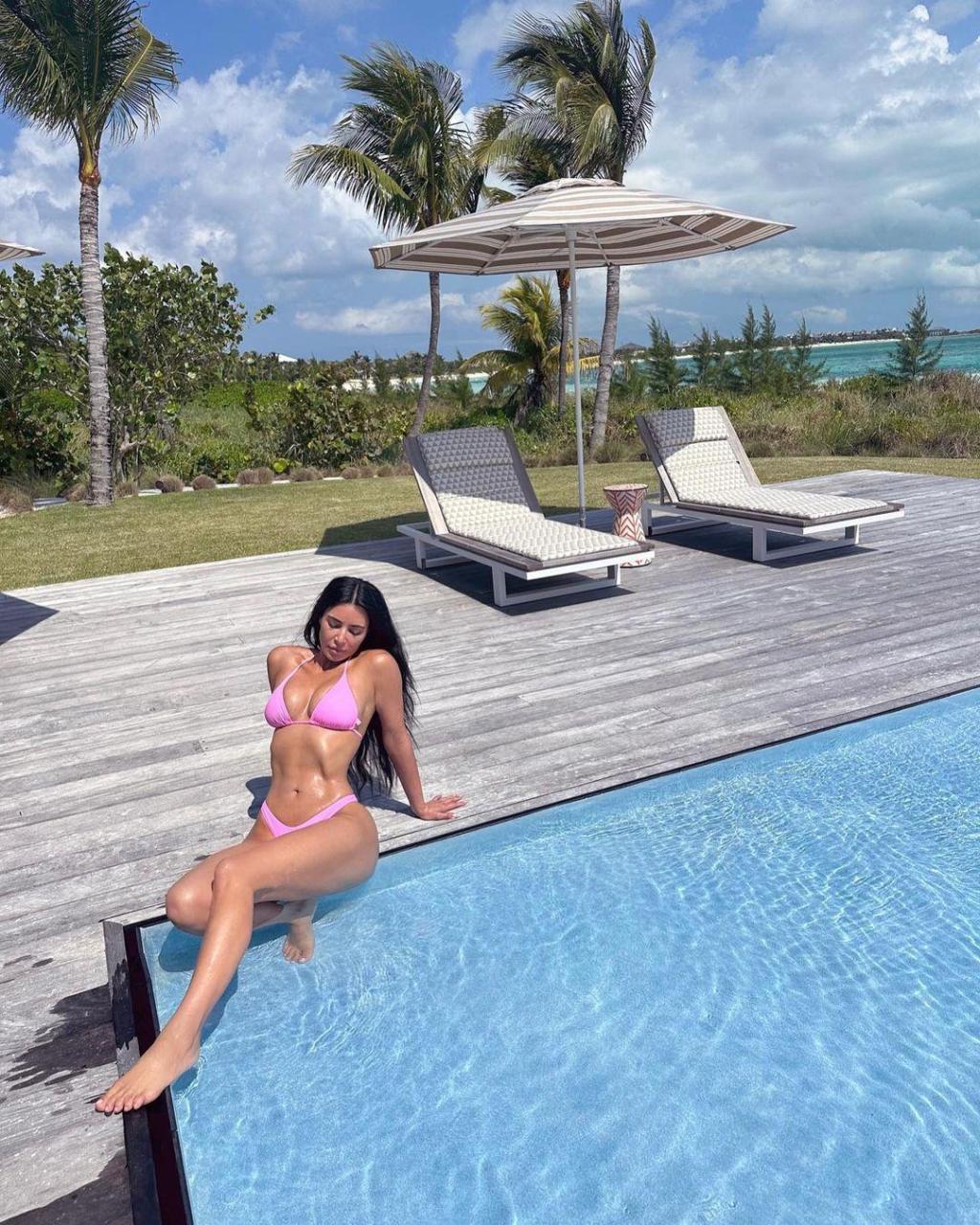 Fans Question Kim Kardashian's Age As She Soaks Up The Summer Sun In Pink Bikini