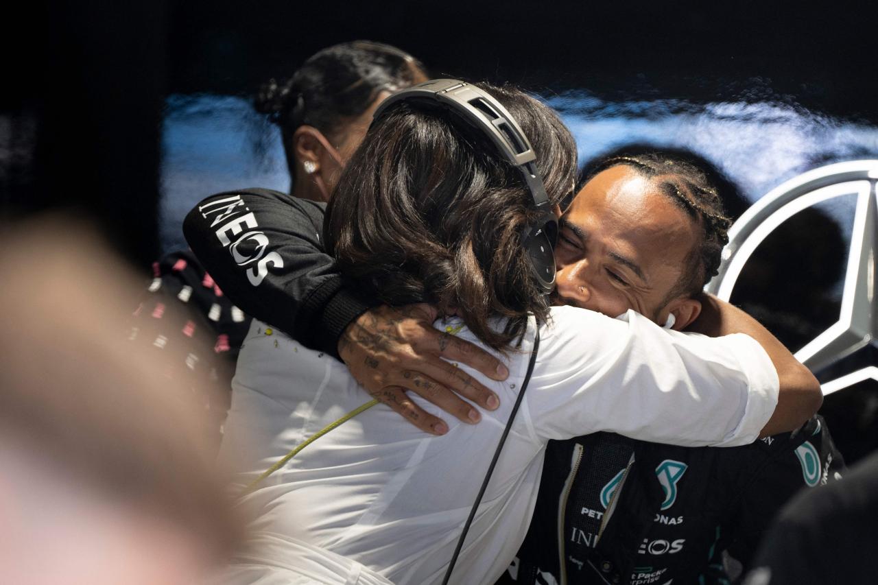 The former First Lady shared a hug with Hamilton before the race