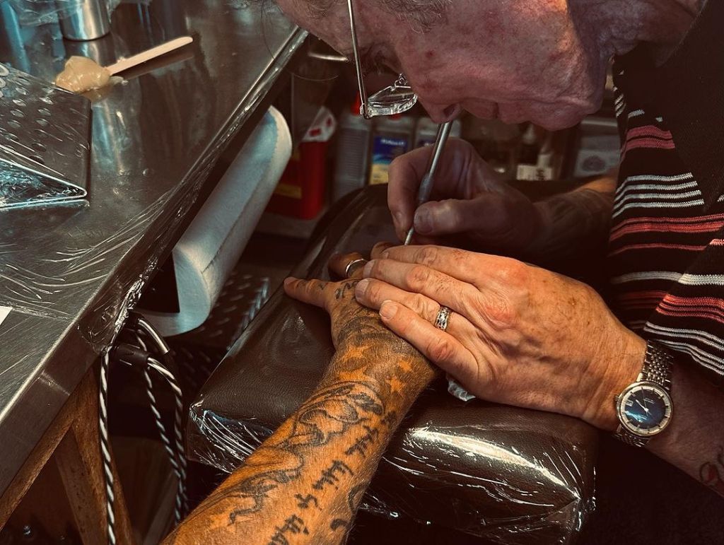 Mark Mahoney tattooing David Beckham's arm