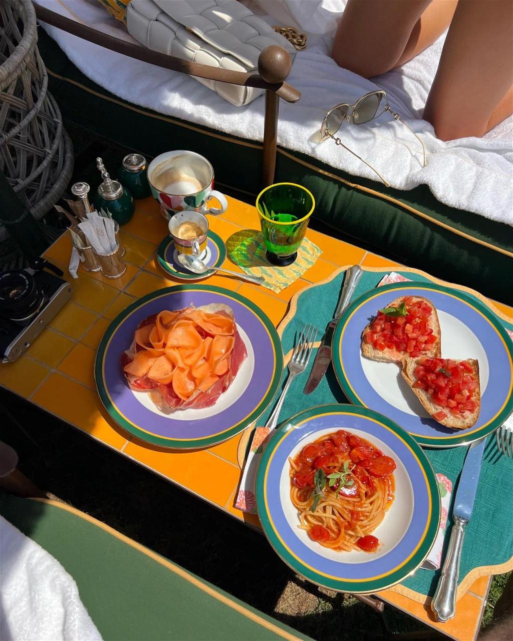 Olivia Culpo Enjoys A Plate Of Pasta In Her Lemon-Print Bikini