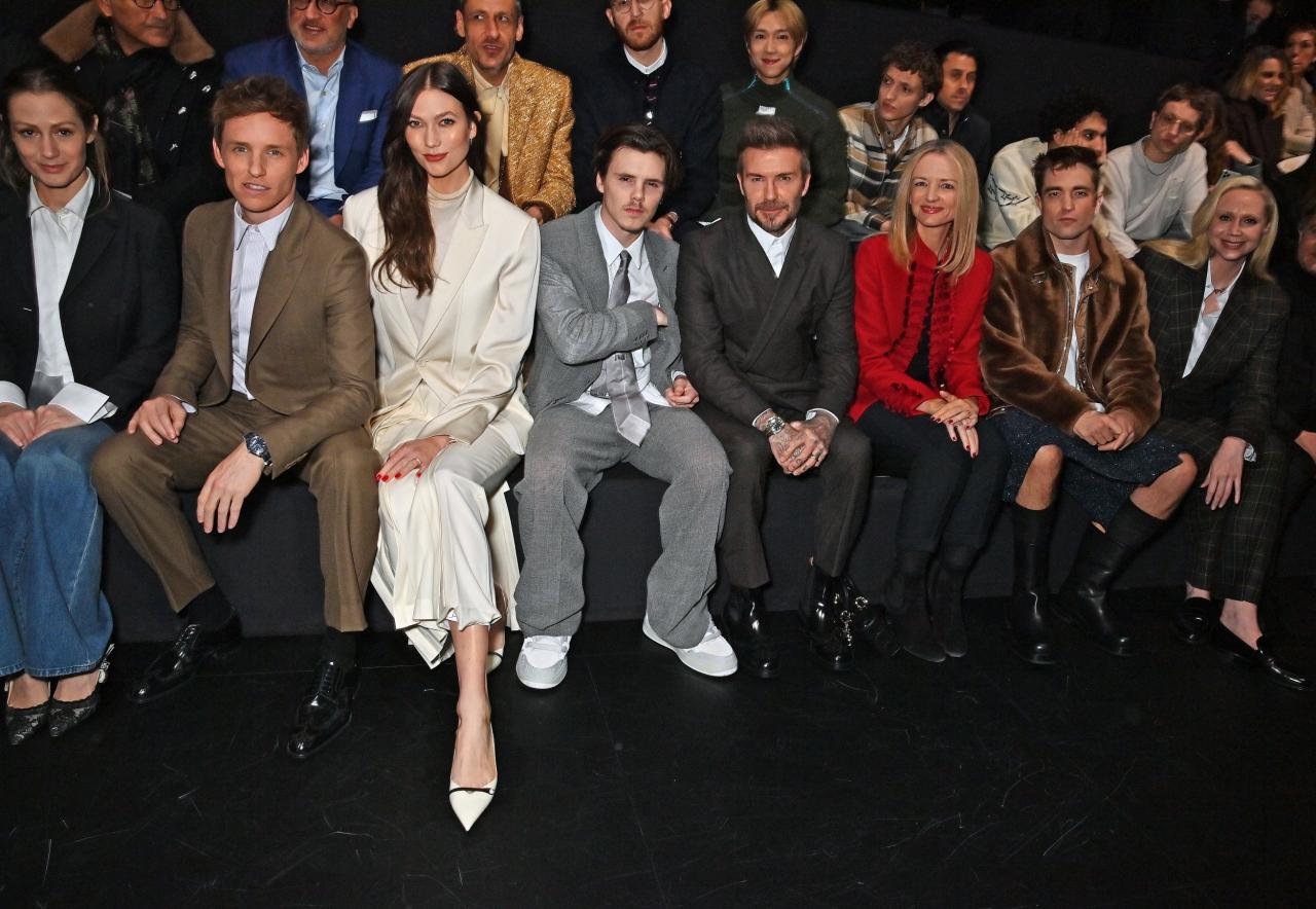 (L to R) Hannah Redmayne, Eddie Redmayne, Karlie Kloss, Cruz Beckham, David Beckham, Delphine Arnault, Robert Pattinson and Gwendoline Christie 