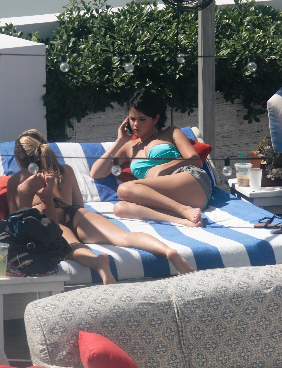 Soaking up the Miami sun in style! Selena Gomez looks absolutely radiant and positively glowing in her gorgeous bikini.