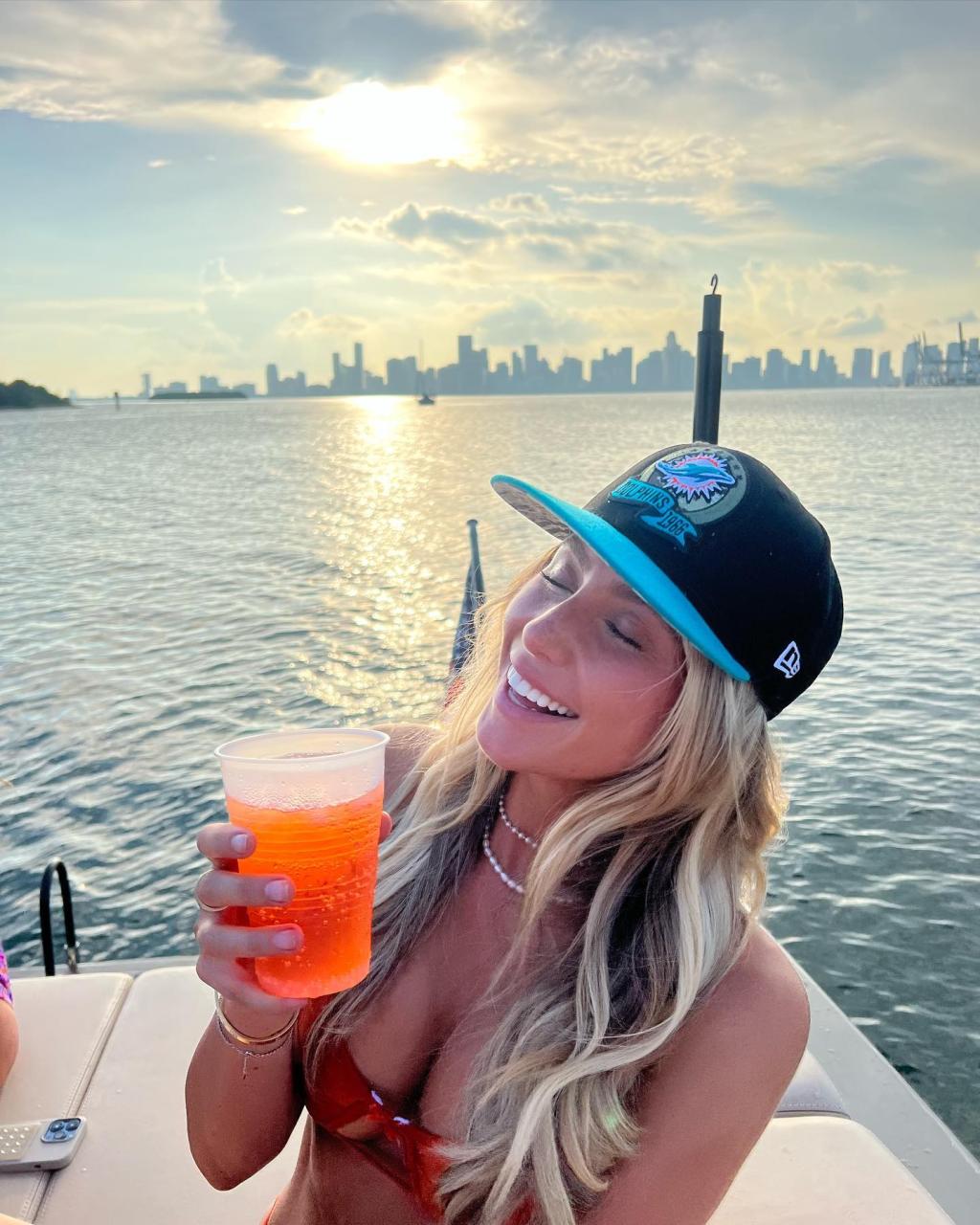 TikTok Star Alix Earle In Orange Bikini Shows The ‘Escalation Of Boat Day’