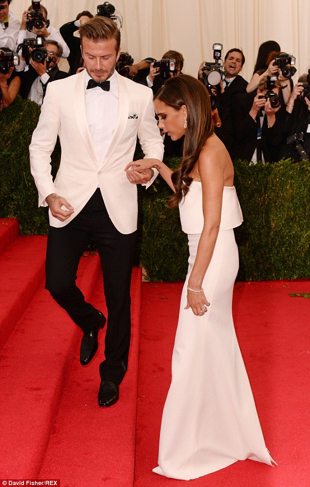 What a gent: The handsome sportsman helped his wife up the steps