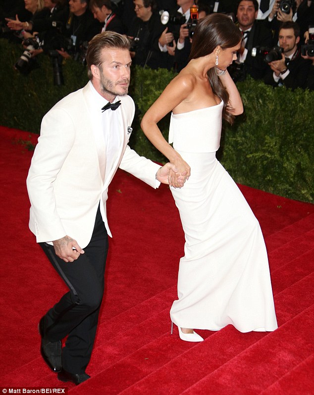 Power couple: David and Victoria Beckham looked incredible in white as they arrived at the Met Gala in New York on Monday night