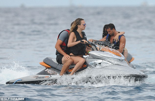 Having a ball: Selena jetskiied with new male companion, Tommy Chiabra, later in the day