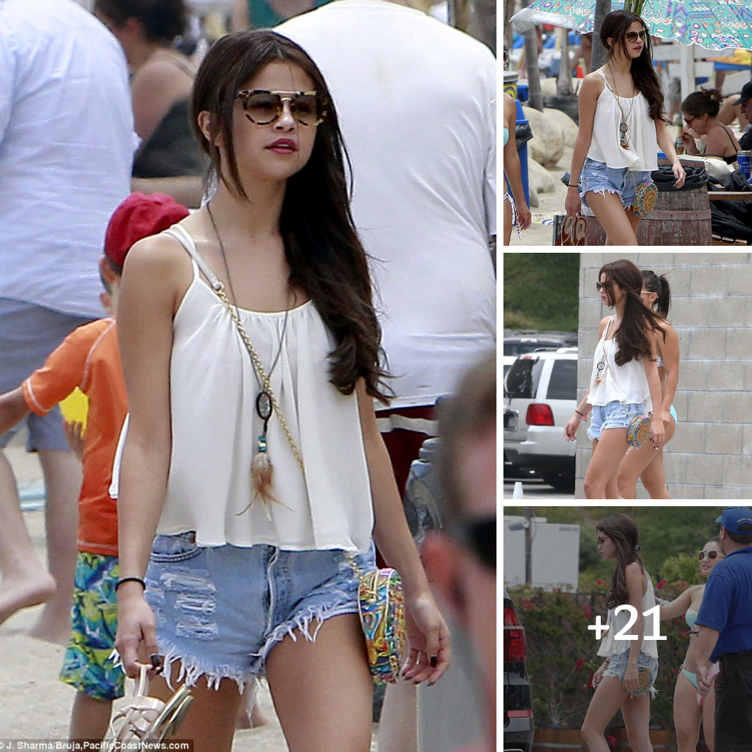 Selena Gomez is a summer siren in flowing top and tiny shorts as she hits the beach with gal pal