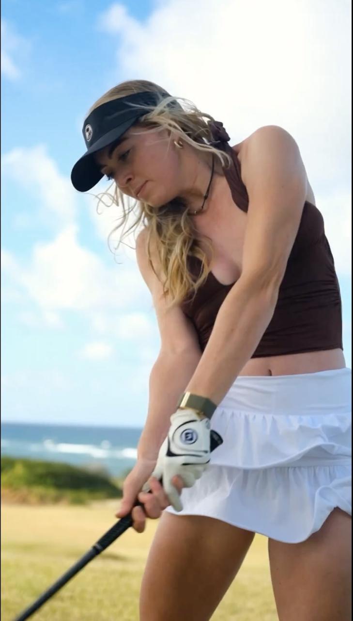 The golf influencer, 22, showed off her powerful golf swing on the links