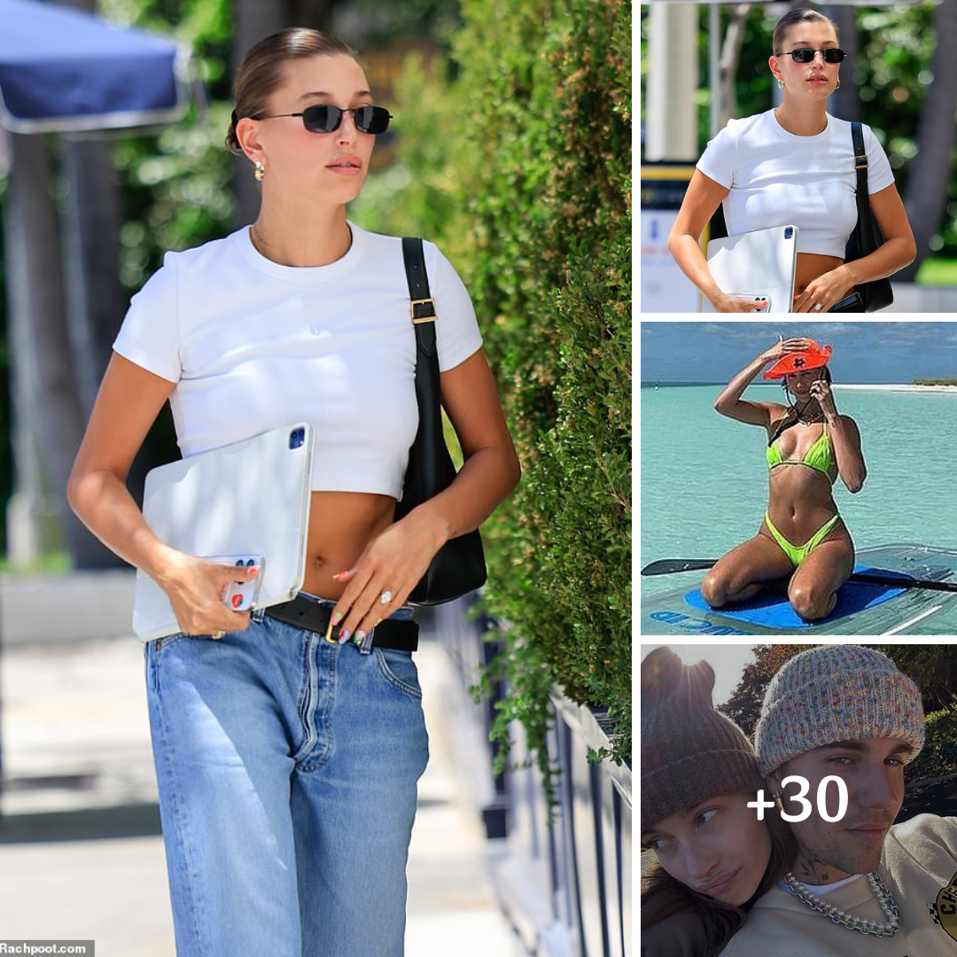 Hailey Bieber showcases her toned abs in a white crop top and low-rise jeans as she steps out for a meeting in West Hollywood