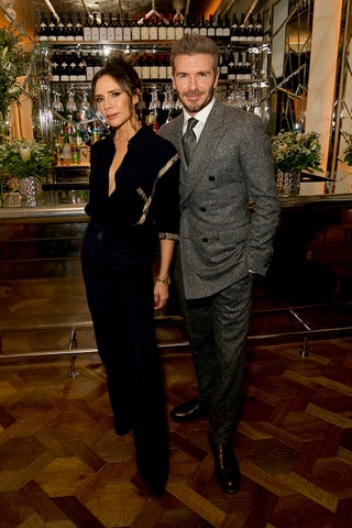 Image may contain David Beckham Victoria Beckham Human Person Tie Accessories Accessory Bar Counter Pub and Fashion