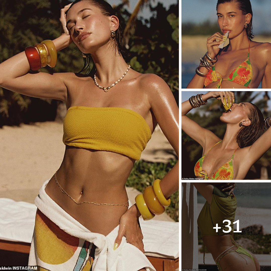 Hailey Bieber flashes her very toned tummy as she models swimsuits