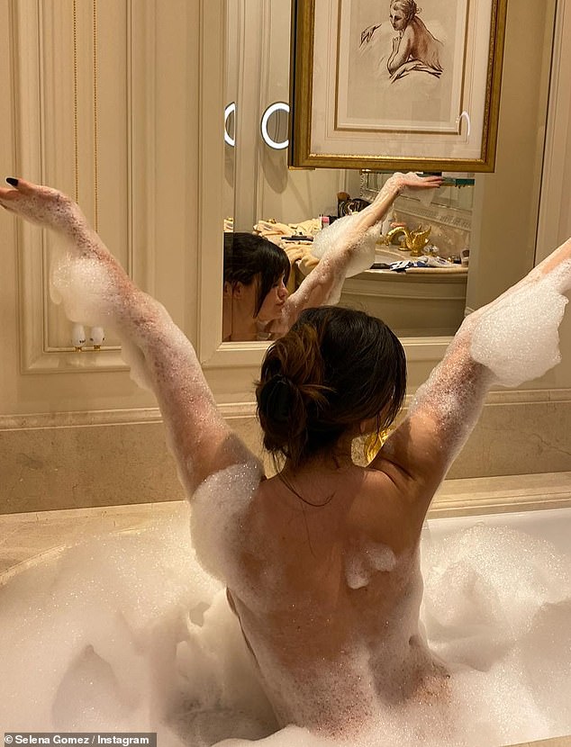 Selena Gomez strips off for bathtub fun and indulges in croissants during '40 hours' in Paris... as she prepares to drop new single Love On