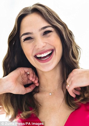 Photogenic: Gal's natural beauty shone through as she posed for beautiful happy portraits at the event