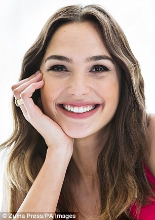 Photogenic: Gal's natural beauty shone through as she posed for beautiful happy portraits at the event