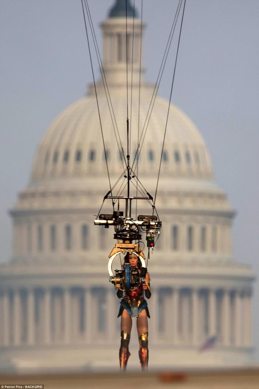 Professional help: The stunt double, who wore a wig to look just like Gal, was used for the more ambitious stunts in front of the Capitol, rising high into the air