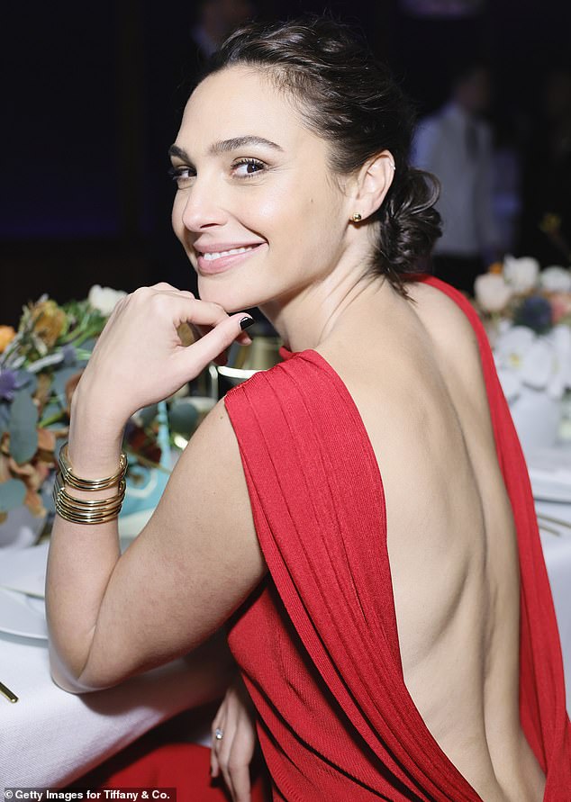 Ravishing in red: Gal Gadot joined an A-list crowd at the Tiffany & Co Lock Event at the iconic Sunset Tower H๏τel in West Hollywood on Wednesday night