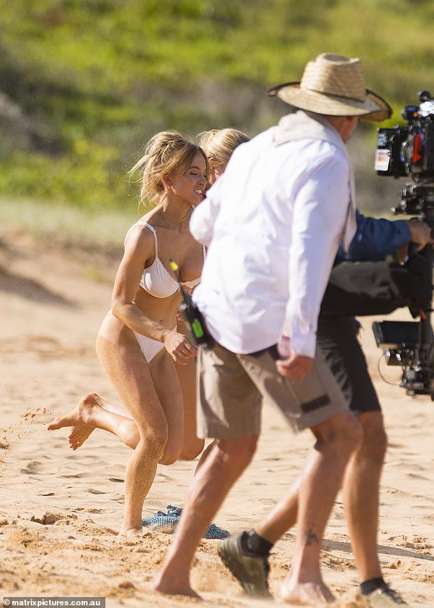 A group of camera operators and crew members filmed the action from the beach