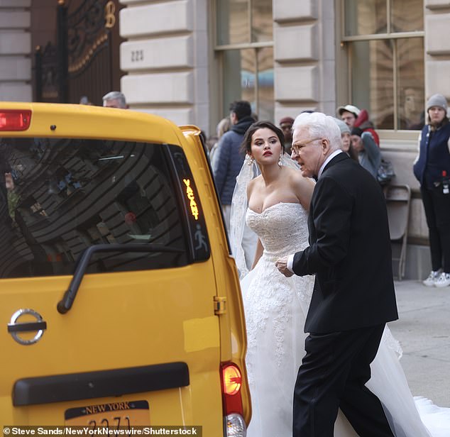 Helping hand: Steven helped Selena get into the backseat of the taxi for the scene