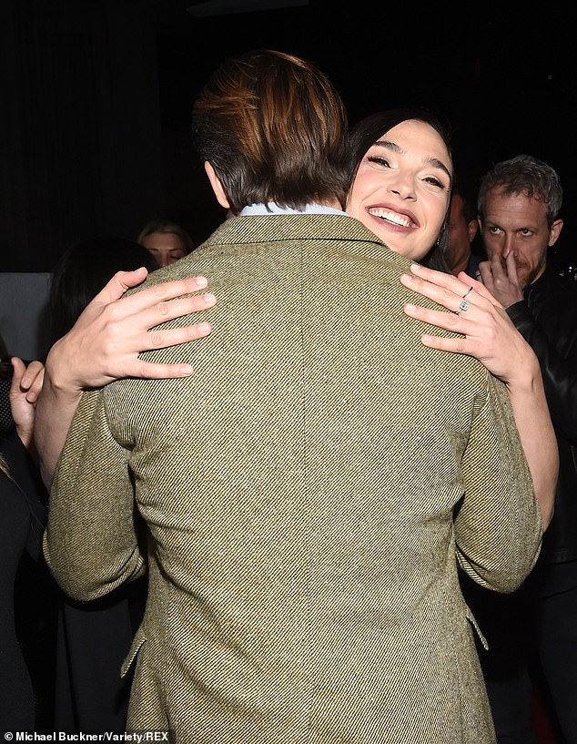 Pals: Gal and Chris shared a big hug