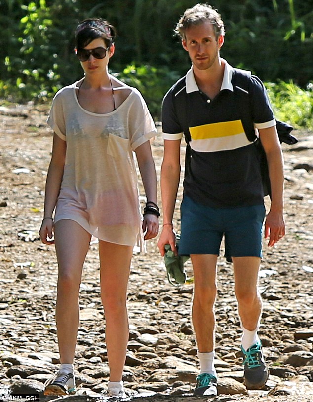 Well earned rest: The pair later slowed down as they enjoyed a romantic stroll in the foliage